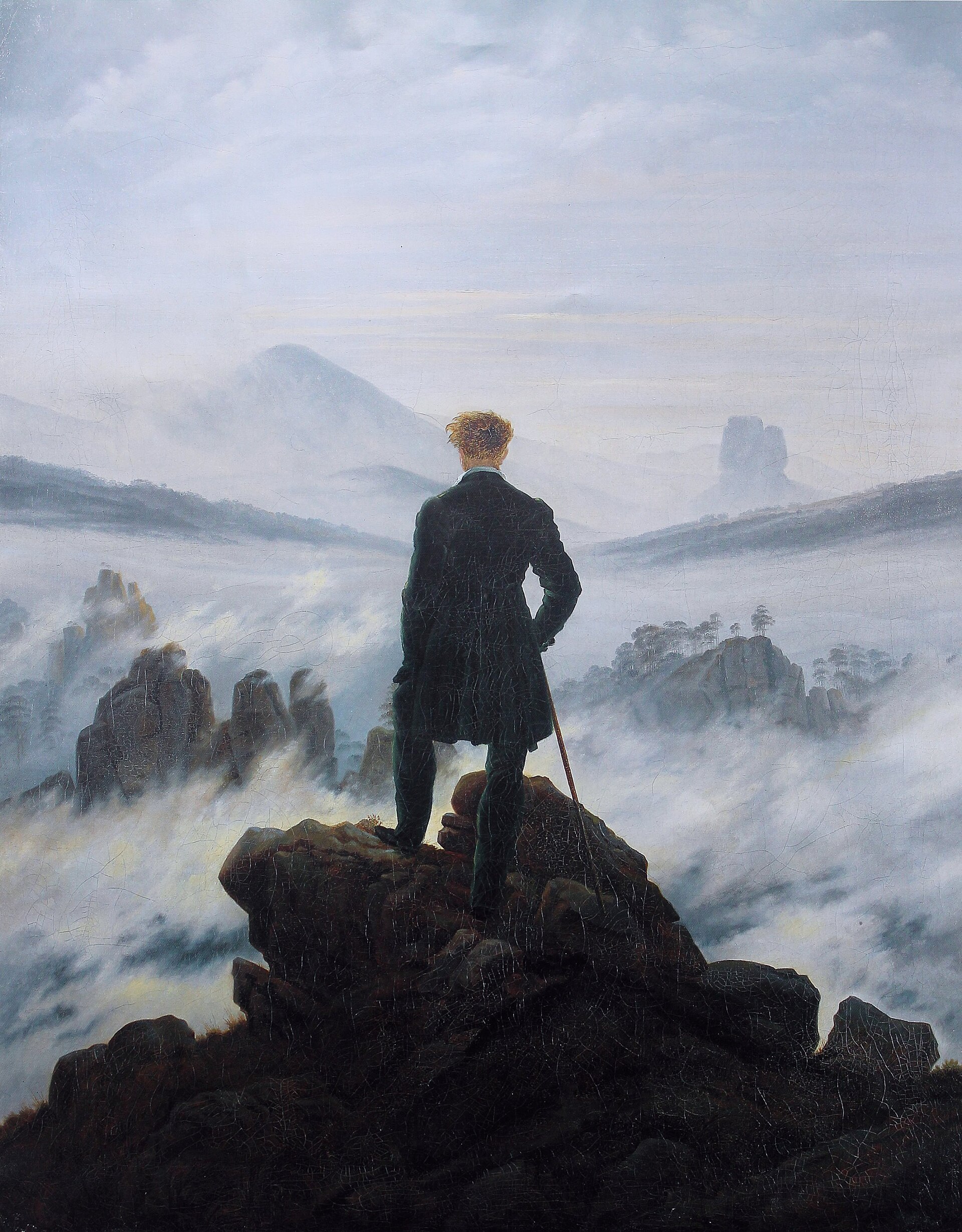 Wanderer above the Sea of Fog — a lone figure on a rocky crag gazing over a sea of mist